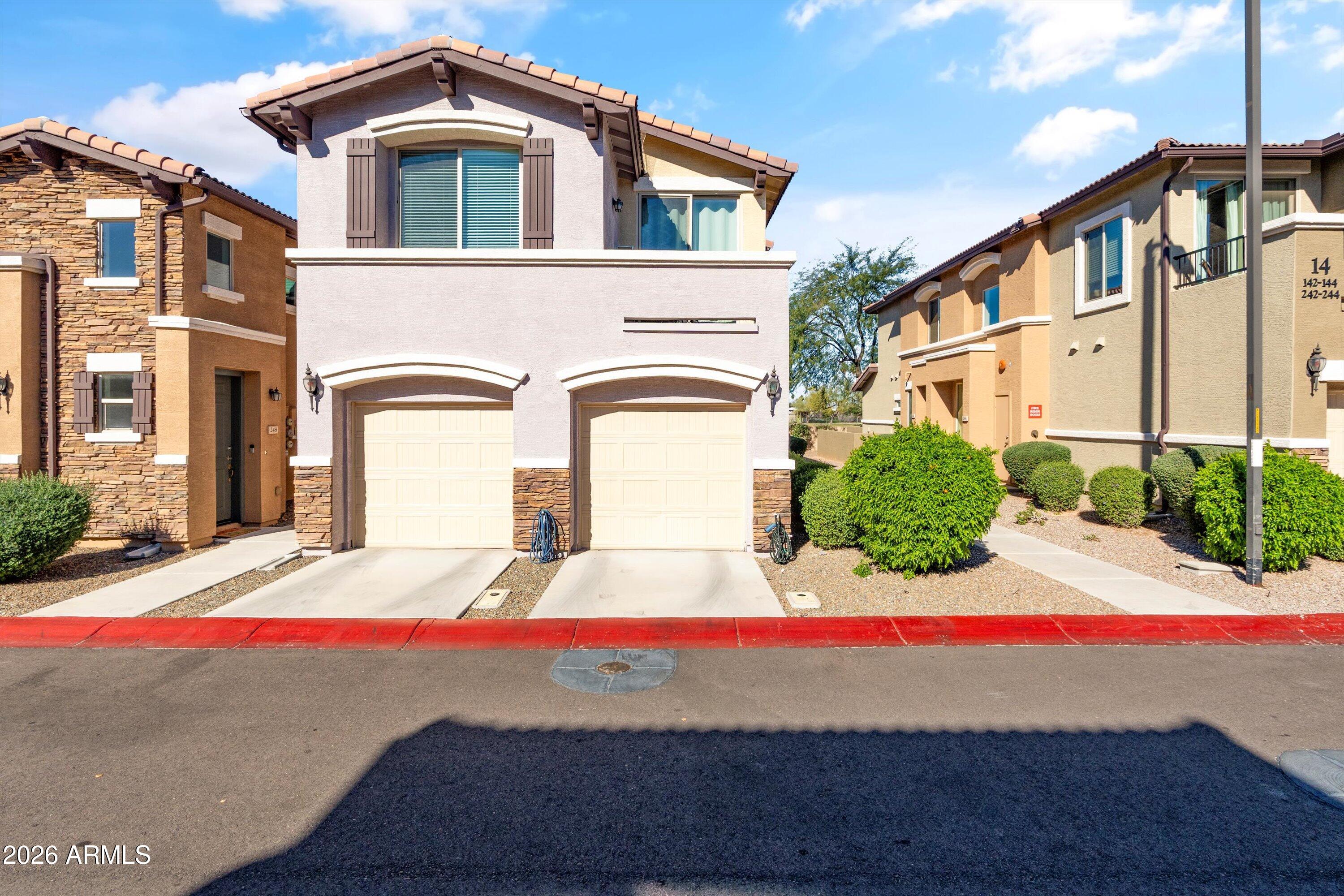 7726 East Baseline Road, Unit 247 Mesa, AZ 85209 - Photo 1 of 29 a front view of a house with garage