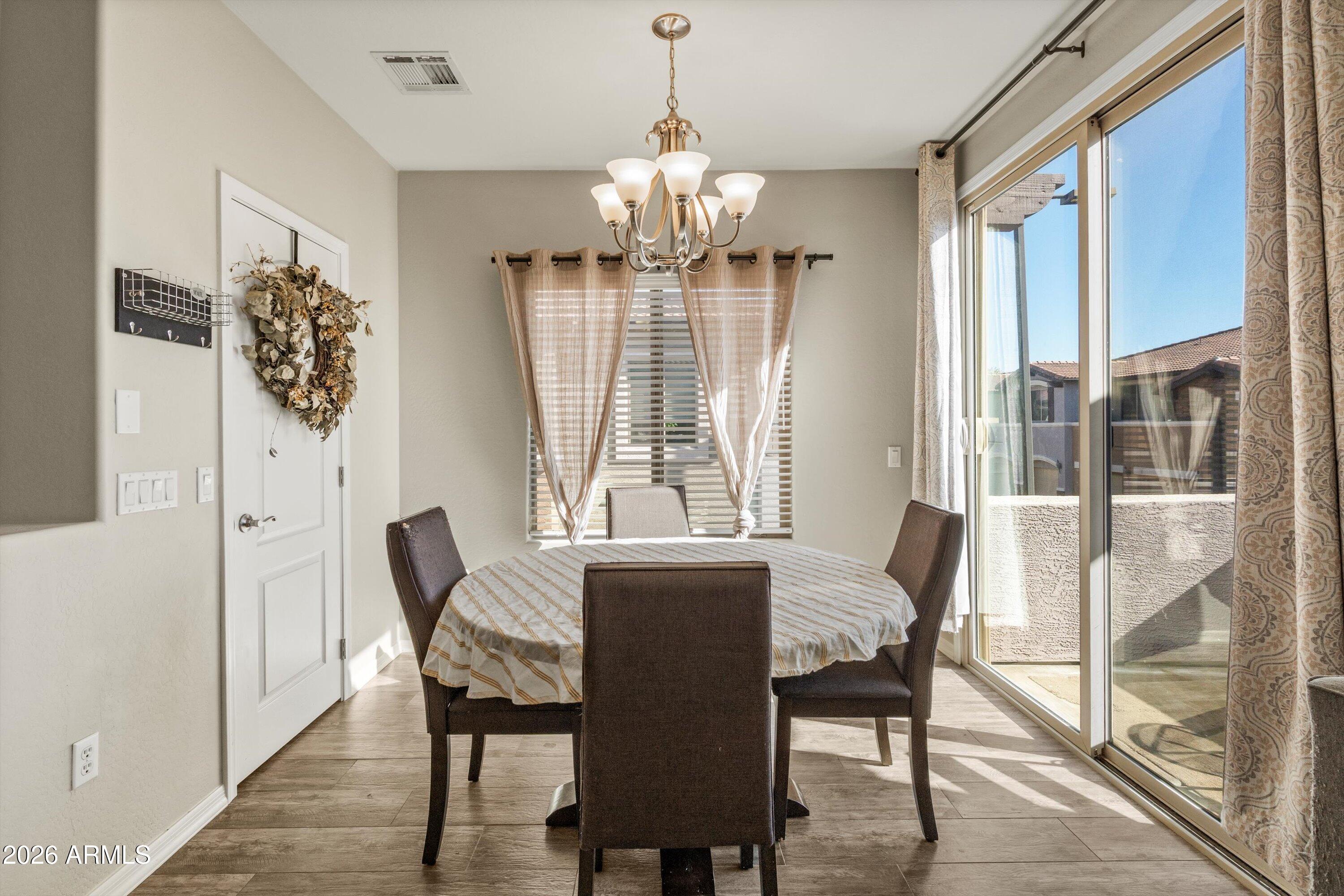 7726 East Baseline Road, Unit 247 Mesa, AZ 85209 - Photo 11 of 29 a view of a dining room with furniture window and outside view
