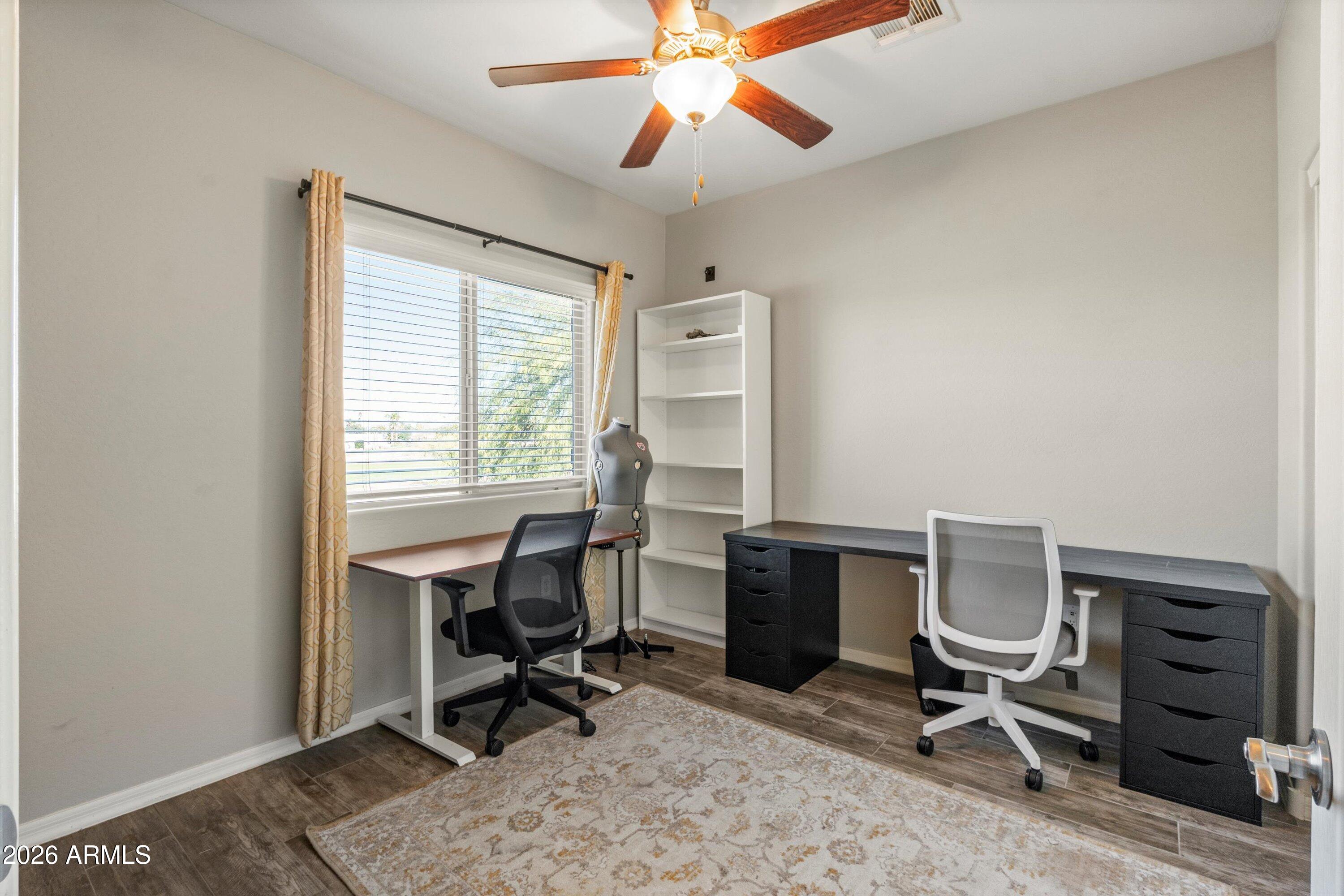 7726 East Baseline Road, Unit 247 Mesa, AZ 85209 - Photo 19 of 29 a view of a workspace with furniture and a window