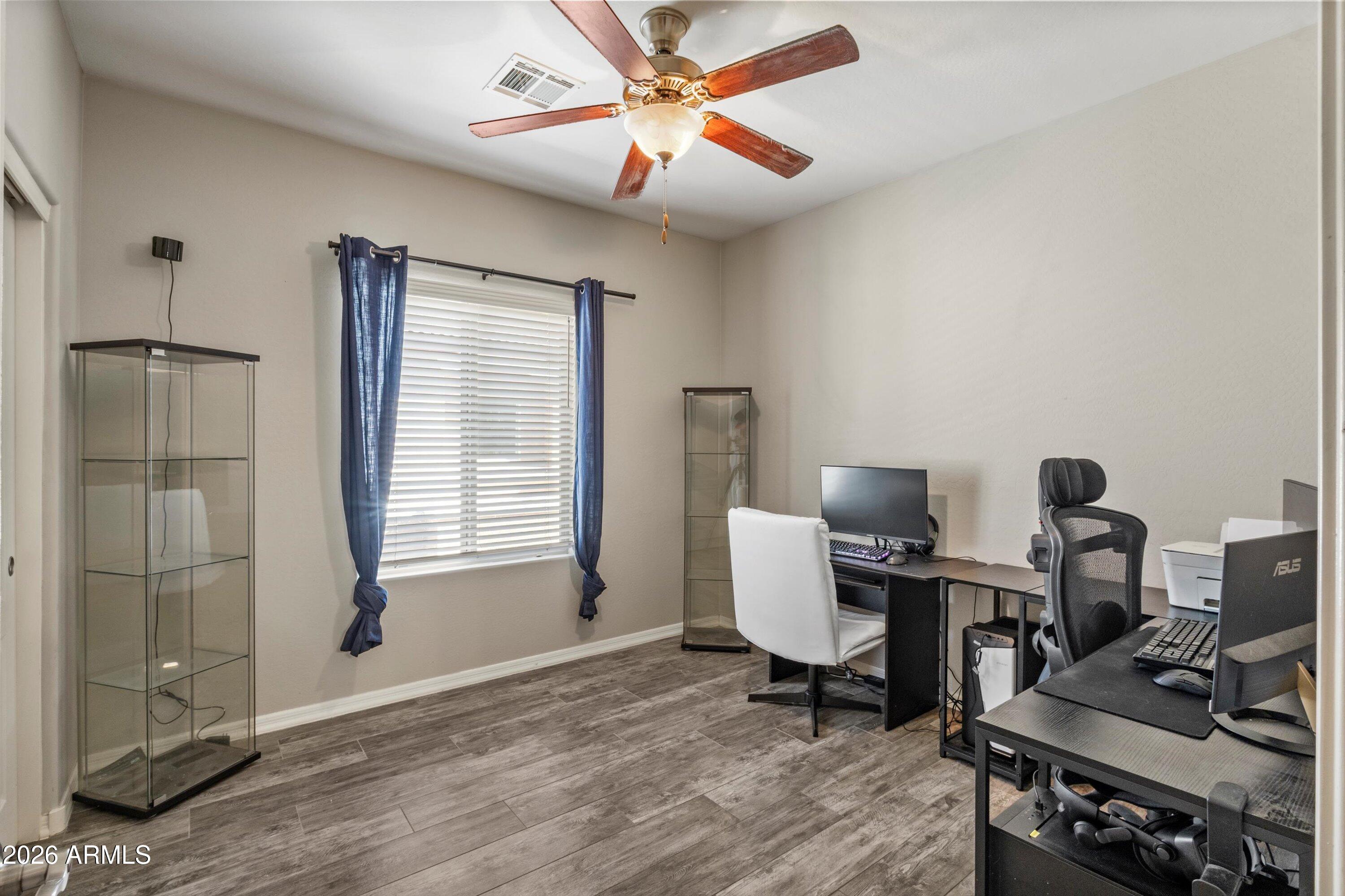 7726 East Baseline Road, Unit 247 Mesa, AZ 85209 - Photo 20 of 29 a workspace with furniture and a window