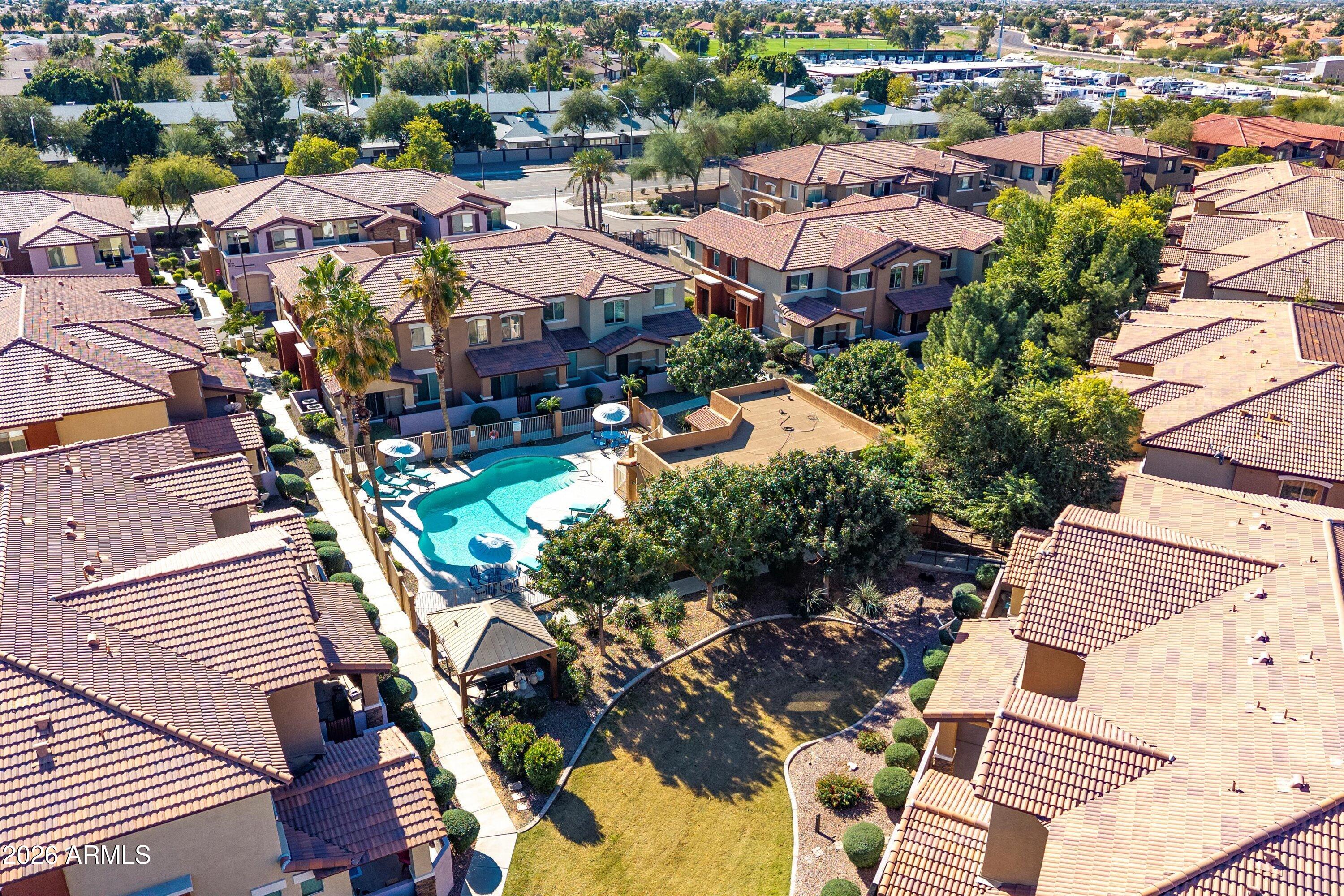 7726 East Baseline Road, Unit 247 Mesa, AZ 85209 - Photo 28 of 29 an aerial view of residential houses with outdoor space
