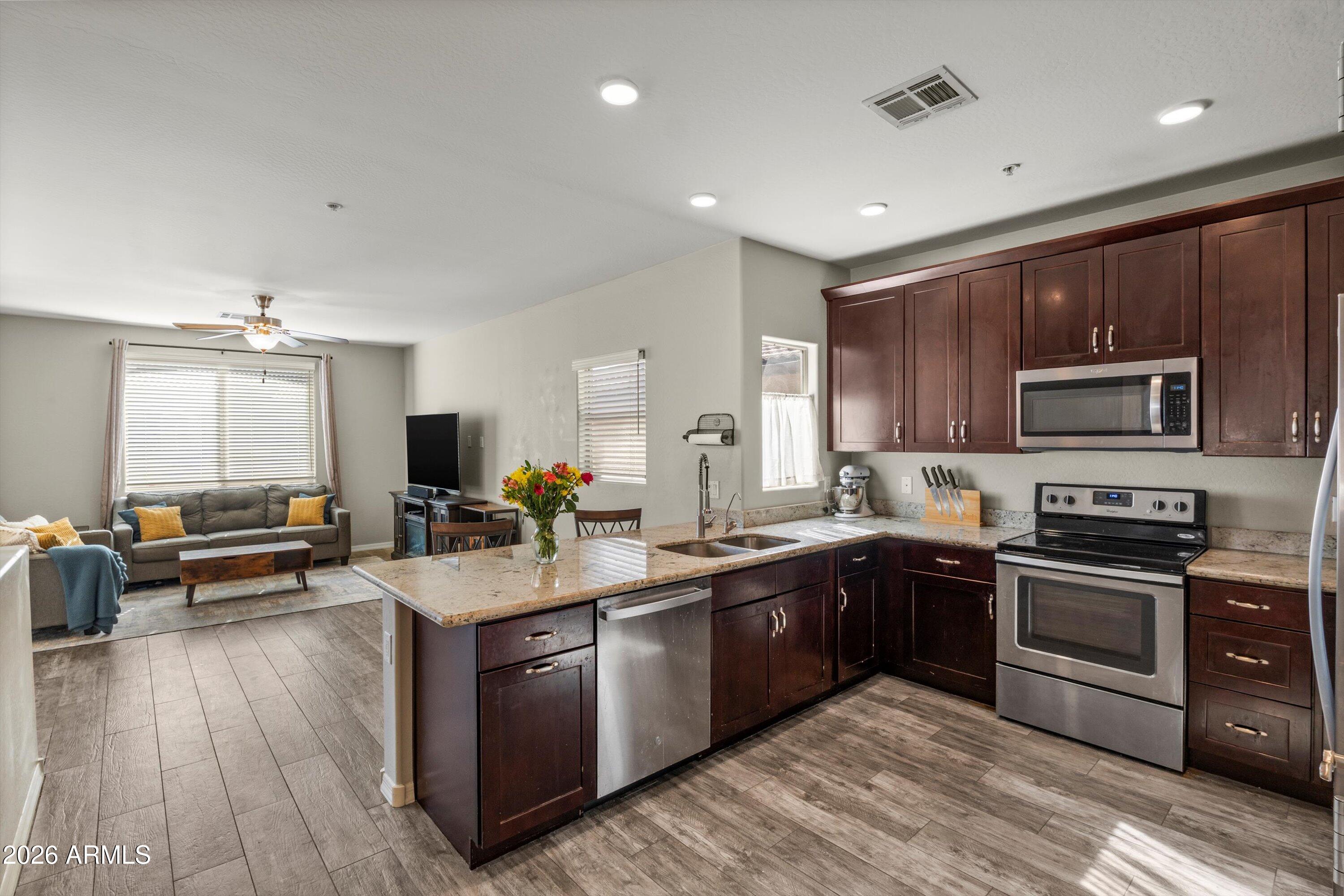 7726 East Baseline Road, Unit 247 Mesa, AZ 85209 - Photo 5 of 29 a large kitchen with cabinets