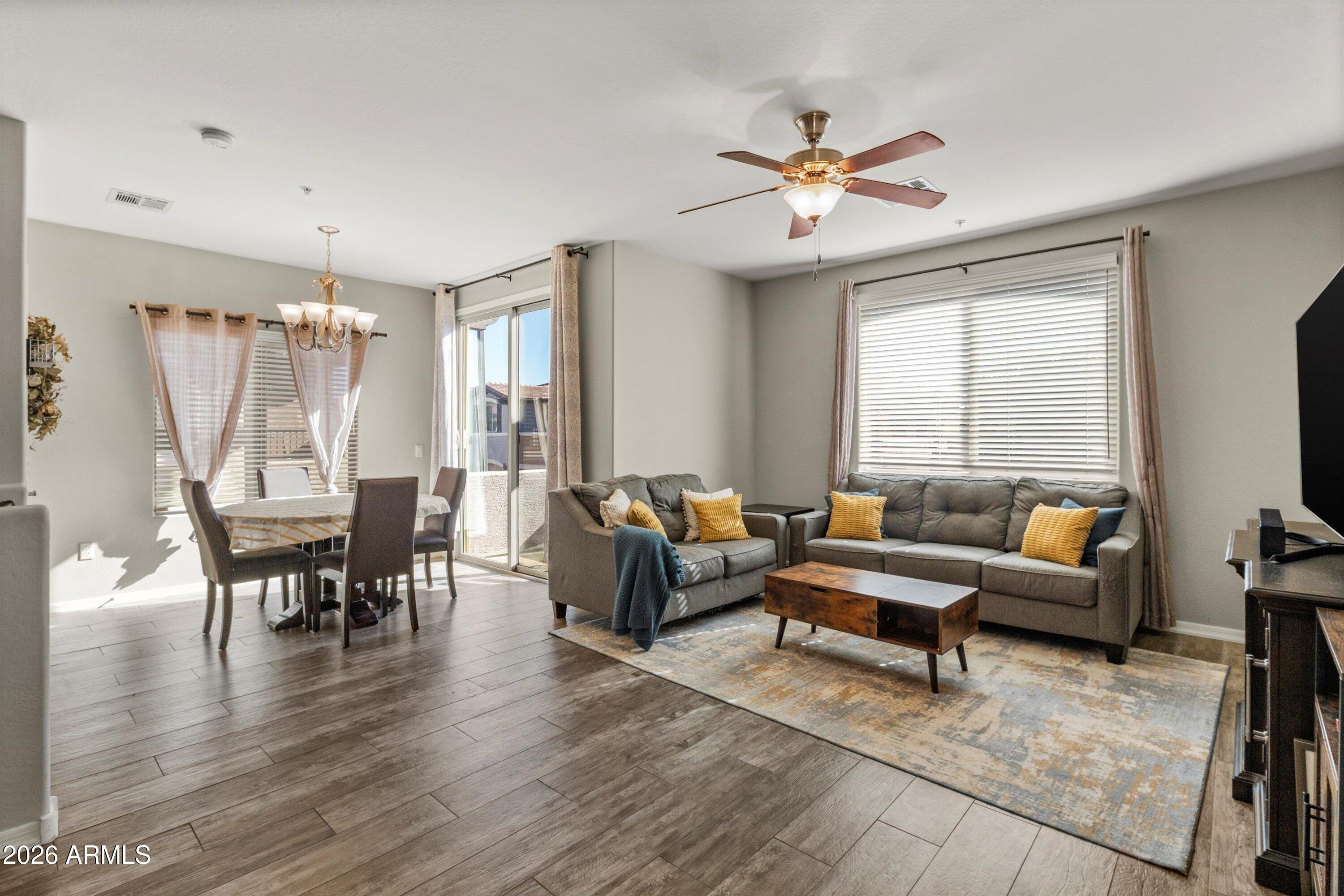 7726 East Baseline Road, Unit 247 Mesa, AZ 85209 - Photo 10 of 29 a living room with furniture and a large window