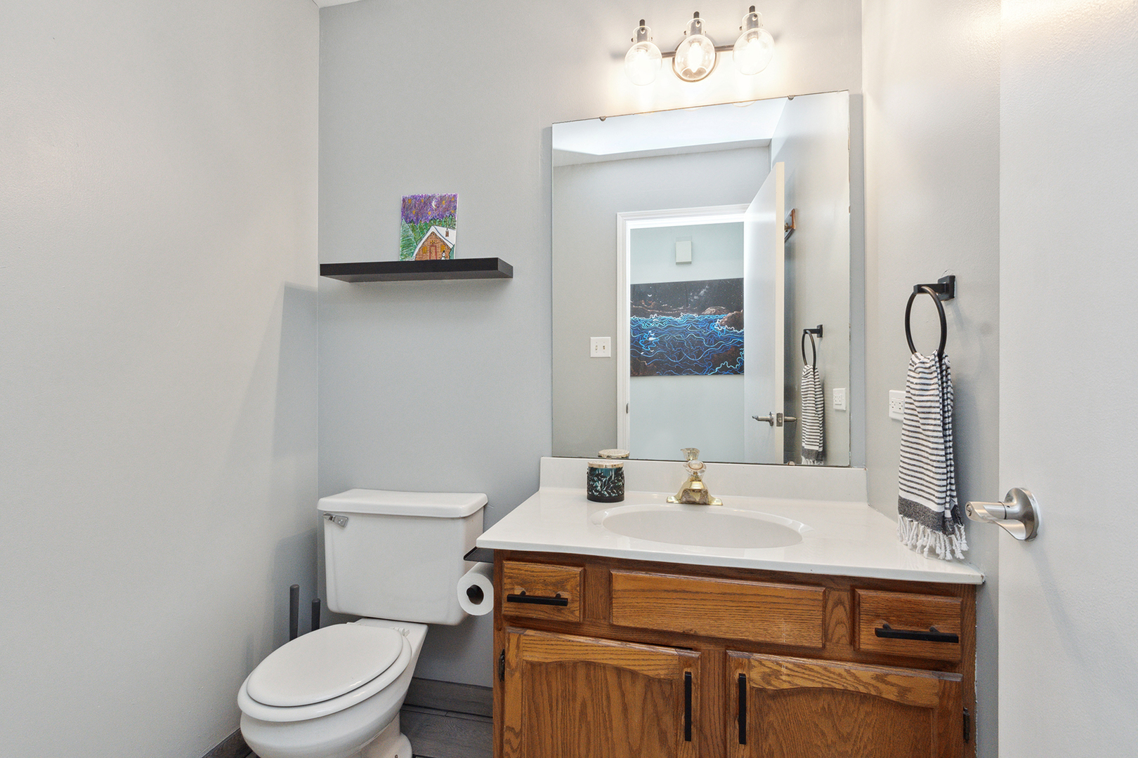 1813 Newport Road Downers Grove, IL 60516 - Photo 12 of 23 a bathroom with a sink toilet and mirror