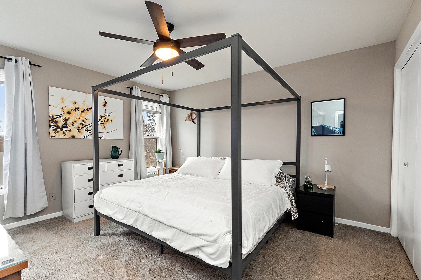1813 Newport Road Downers Grove, IL 60516 - Photo 13 of 23 a bedroom with a bed a ceiling fan and a dresser