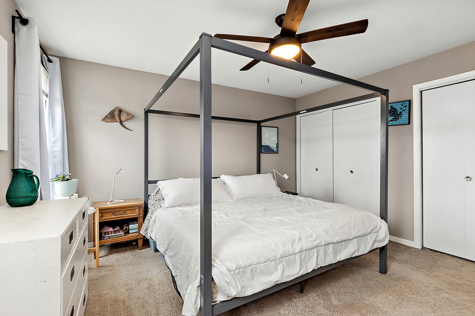 1813 Newport Road Downers Grove, IL 60516 - Photo 14 of 23 a bedroom with a bed next to a window and a ceiling fan