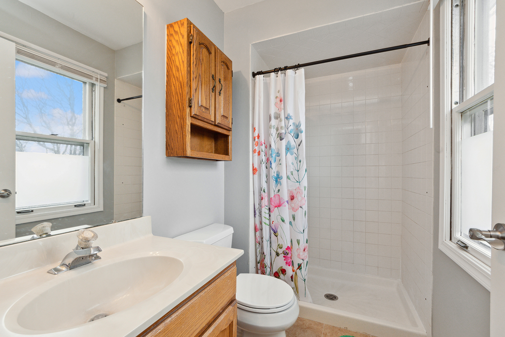 1813 Newport Road Downers Grove, IL 60516 - Photo 15 of 23 a bathroom with a sink toilet and shower