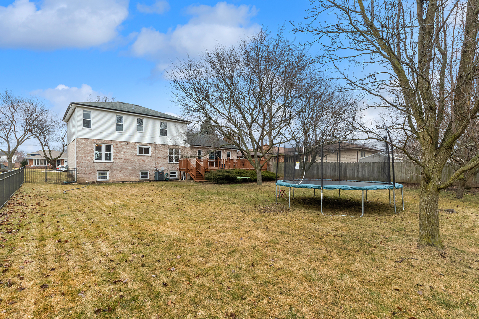 1813 Newport Road Downers Grove, IL 60516 - Photo 20 of 23 a backyard of a house with garden and swing