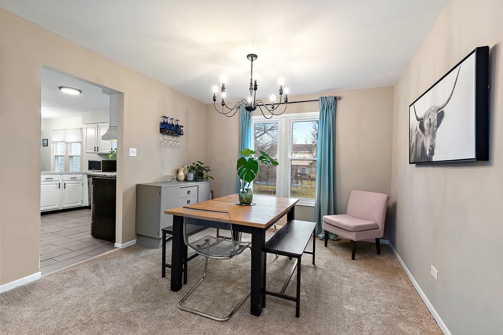 1813 Newport Road Downers Grove, IL 60516 - Photo 4 of 23 a view of a dining room with furniture and a chandelier