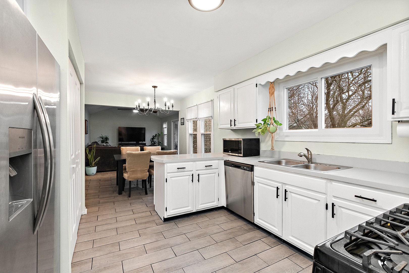 1813 Newport Road Downers Grove, IL 60516 - Photo 9 of 23 a kitchen with a sink cabinets and window