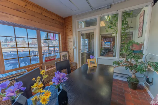a view of a livingroom with furniture and a window
