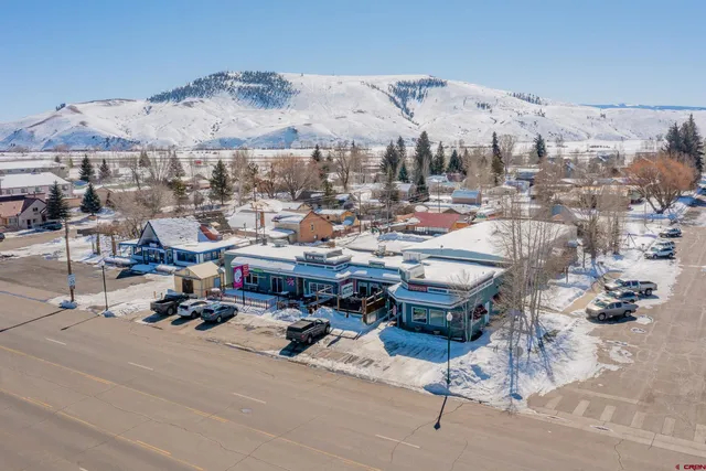 a view of a terrace with furniture and mountain view