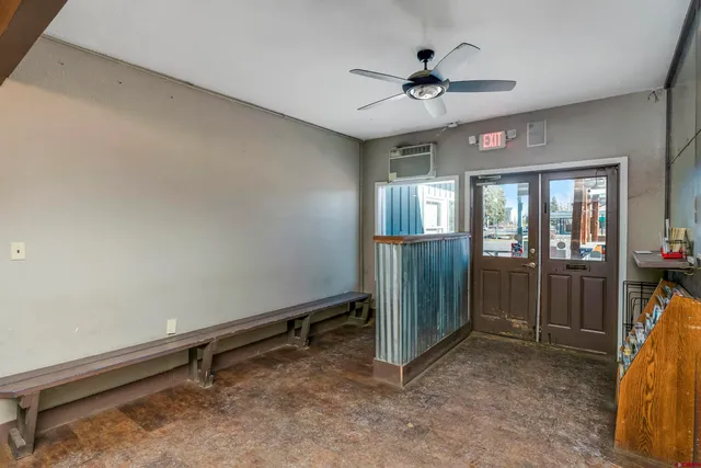 a view of a chairs and table in a room