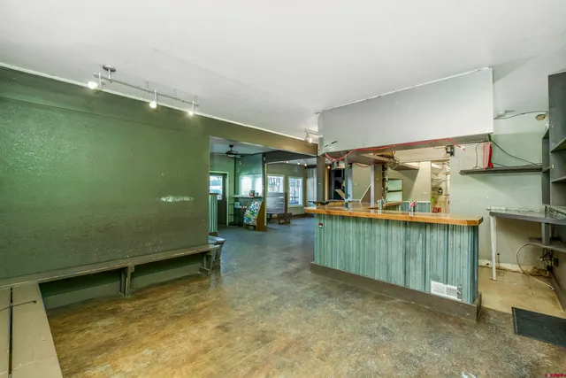 a view of a patio with table and chairs