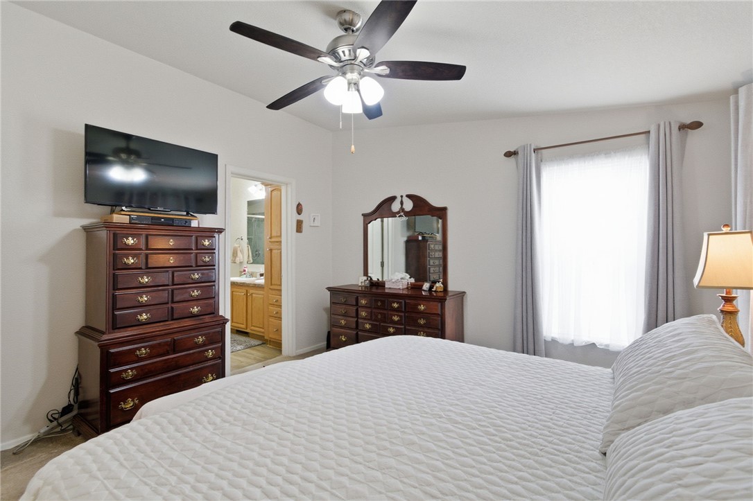 4342 Cordes Road Golden Valley, AZ 86413 - Photo 33 of 39 a bedroom with a bed and a flat screen tv