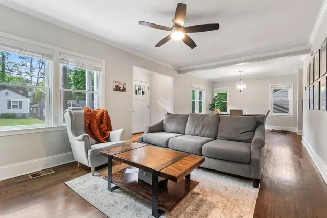 a living room with furniture and a large window