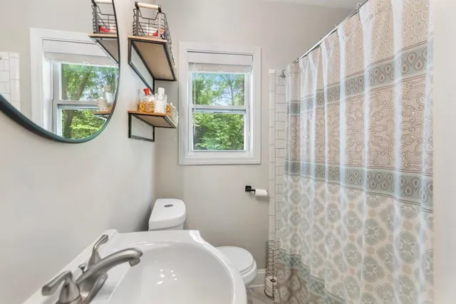 a bathroom with a toilet and a sink