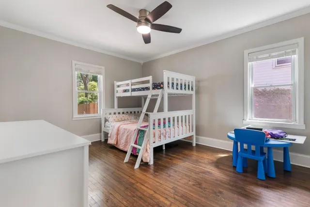 a bedroom with furniture and windows