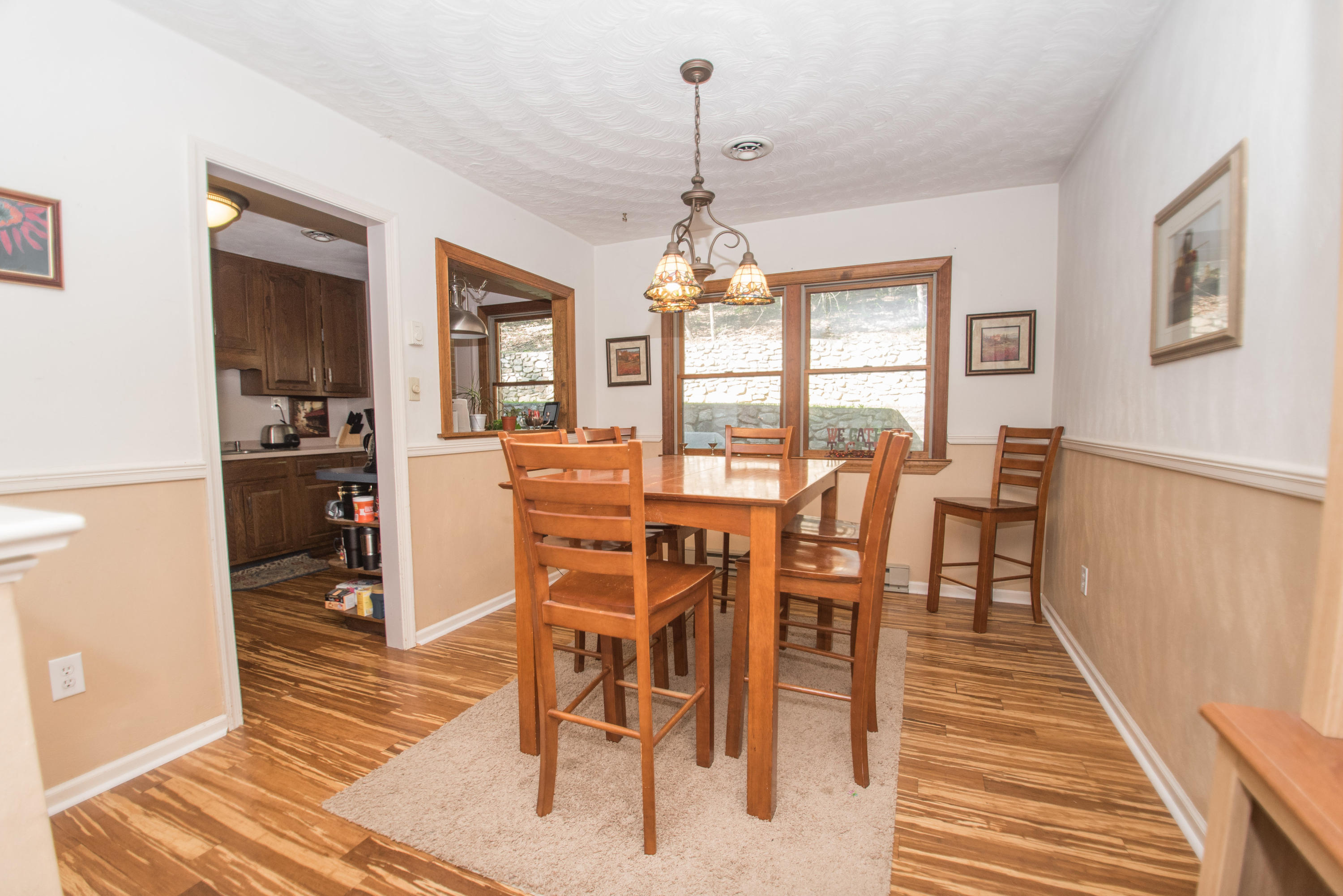 2524 Blue Ridge Springs Road Blue Ridge, VA 24064 - Photo 14 of 44 a view of a dining room with furniture window and wooden floor