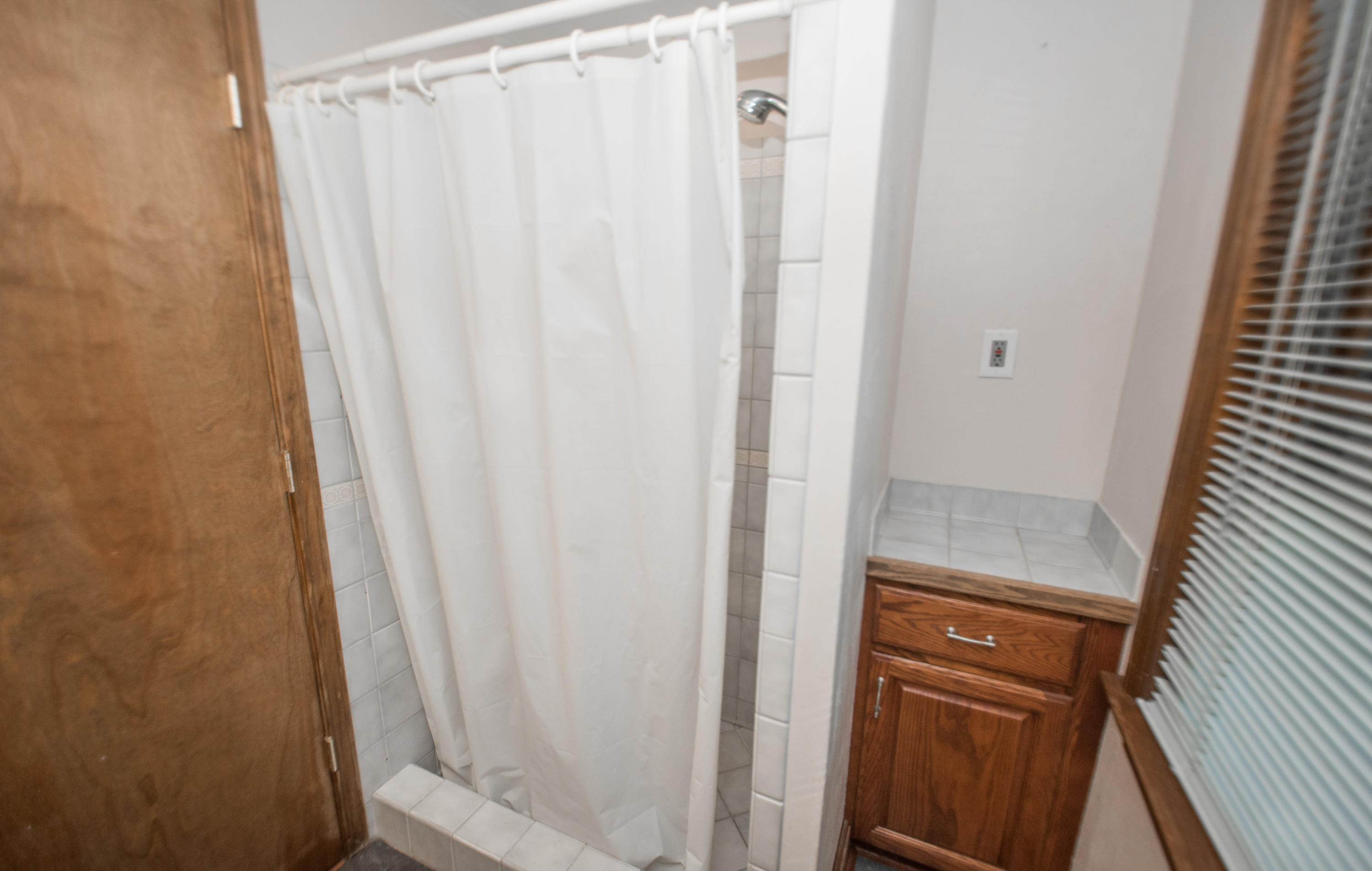 2524 Blue Ridge Springs Road Blue Ridge, VA 24064 - Photo 23 of 44 a bathroom with a shower and a window