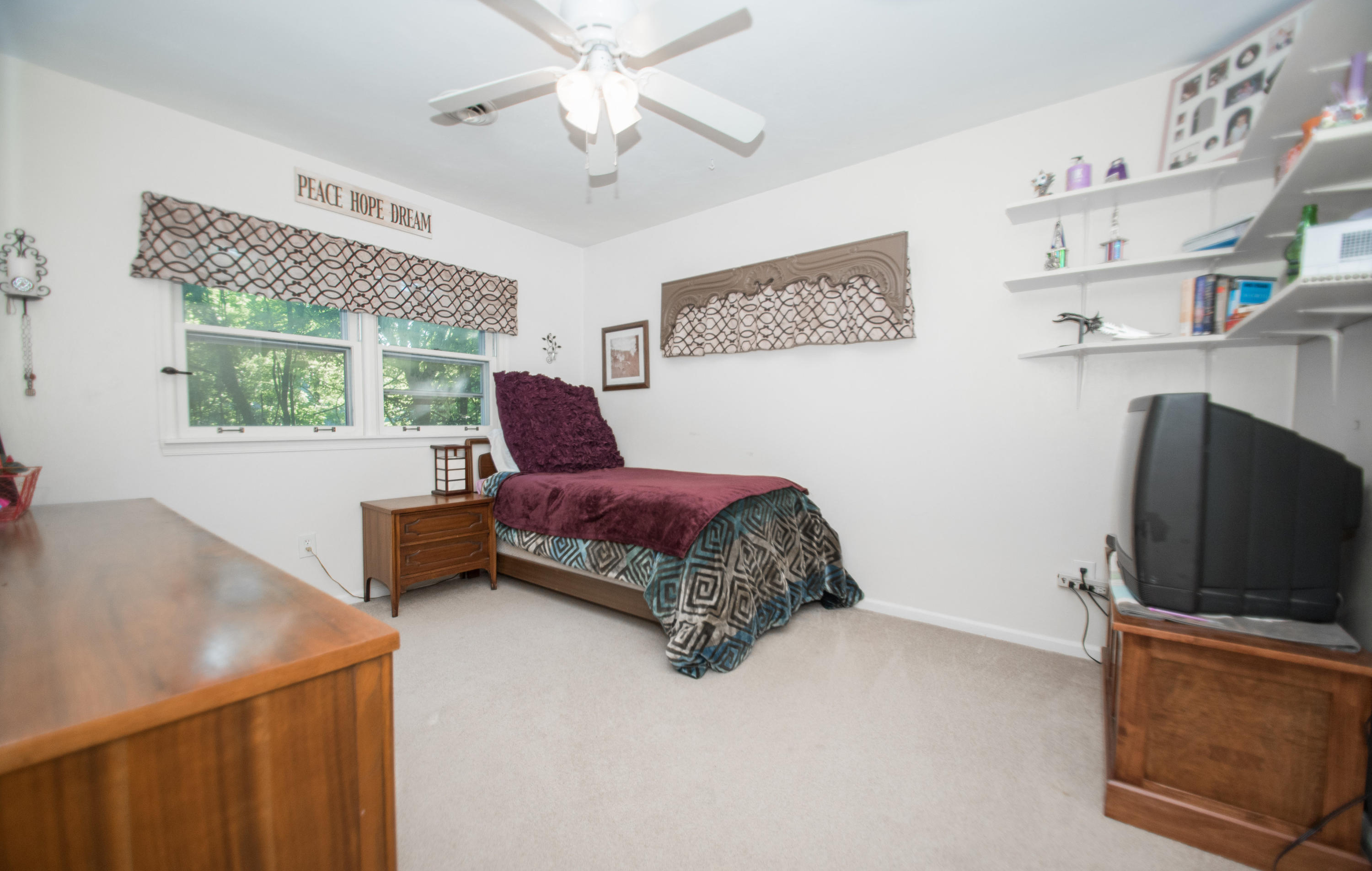 2524 Blue Ridge Springs Road Blue Ridge, VA 24064 - Photo 30 of 44 a bedroom with a bed and a flat screen tv