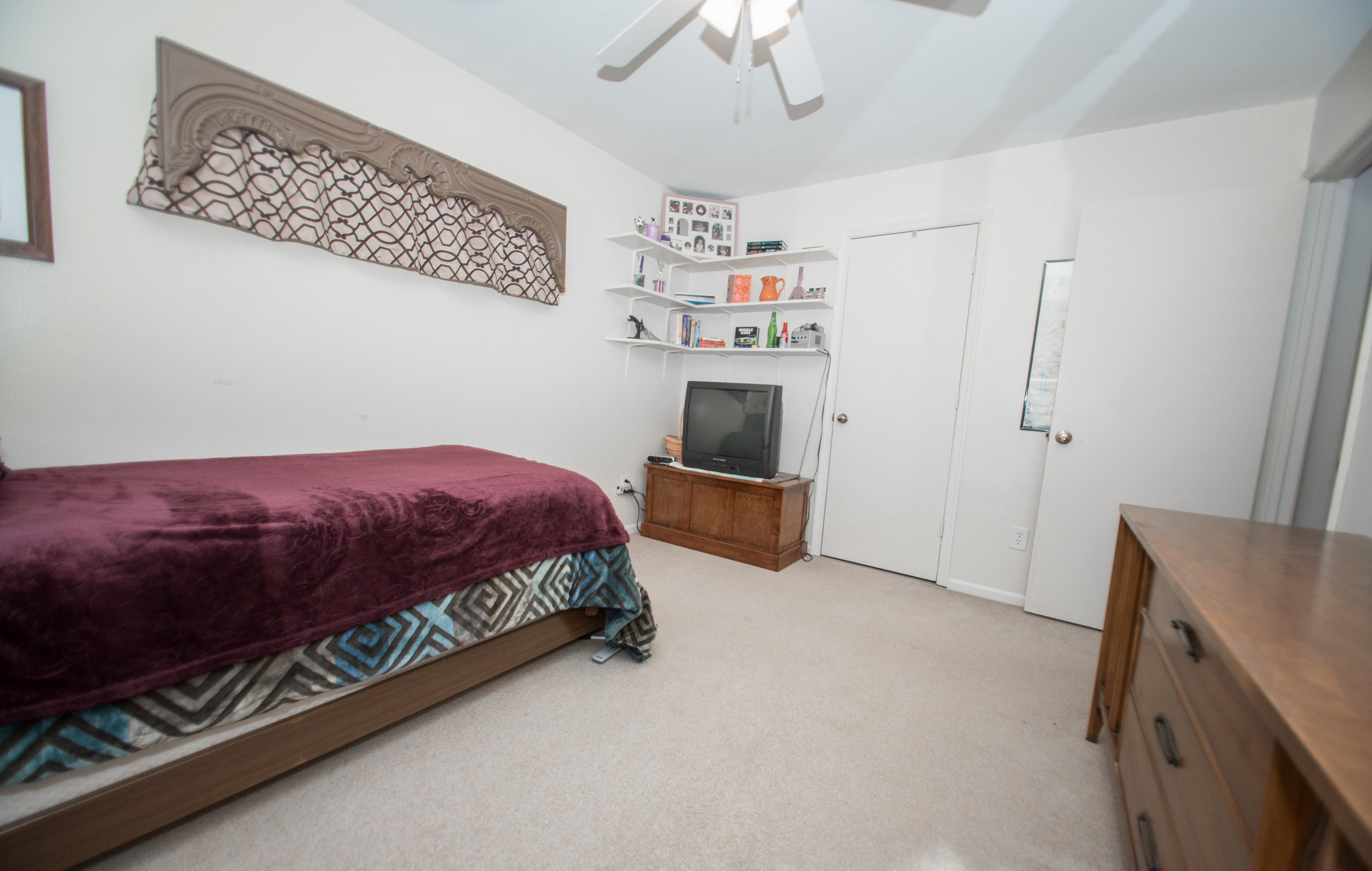 2524 Blue Ridge Springs Road Blue Ridge, VA 24064 - Photo 31 of 44 a bedroom with a bed and a refrigerator