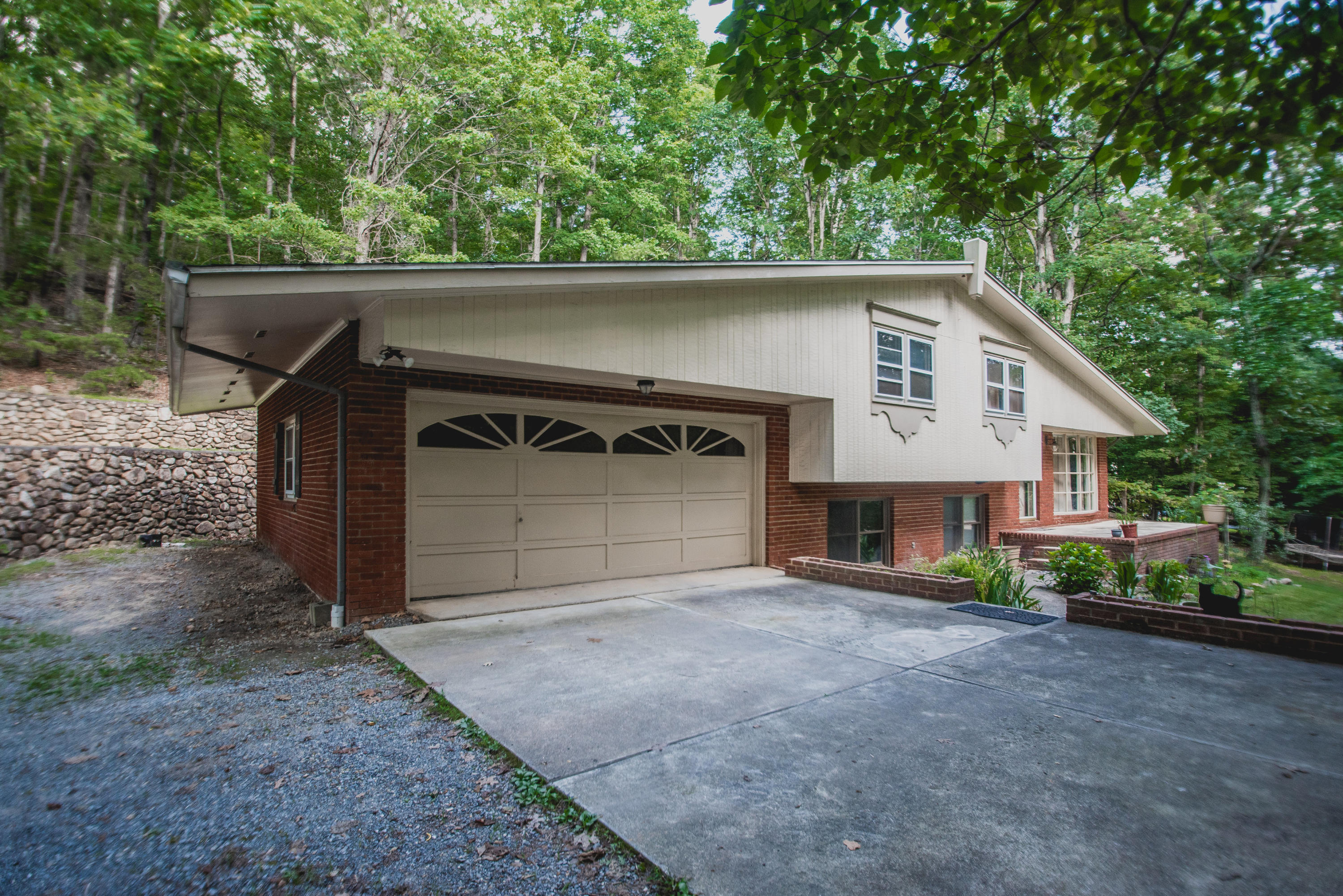 2524 Blue Ridge Springs Road Blue Ridge, VA 24064 - Photo 5 of 44 a view of a house with a yard and garage