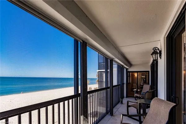 a view of balcony with furniture