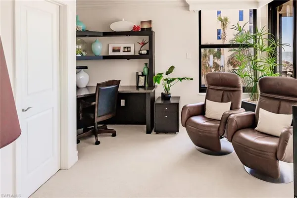 a workspace with furniture and window