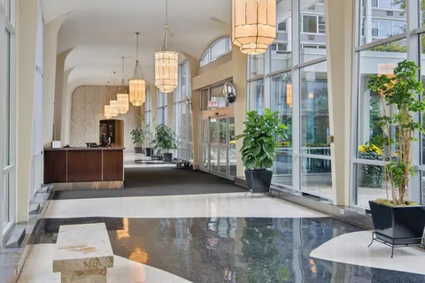 a view of a living room and kitchen
