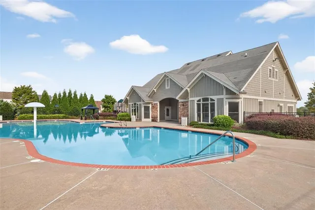 a view of a house with swimming pool