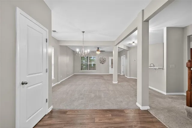 a view of a hallway with wooden shelves