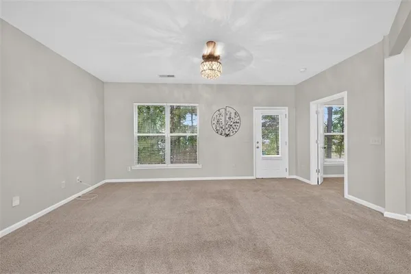 a view of an empty room with a window