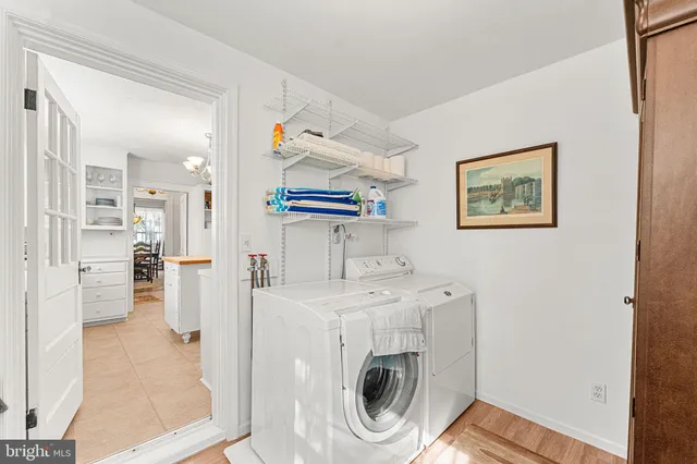 a view of a hallway with washer and dryer