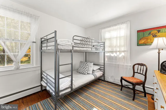 a view of living room with furniture and wooden floor