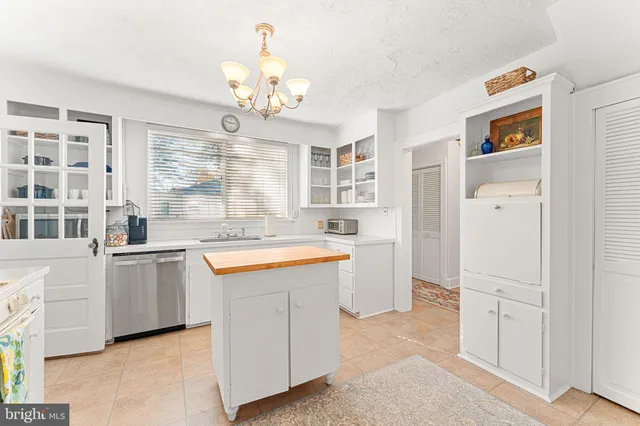 a kitchen with granite countertop cabinets and stainless steel appliances