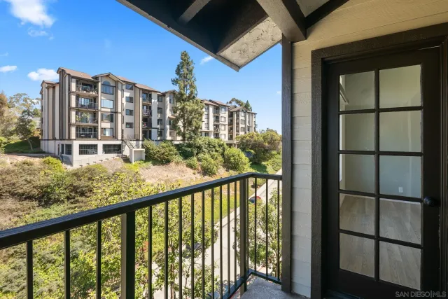 a view of a balcony with city view