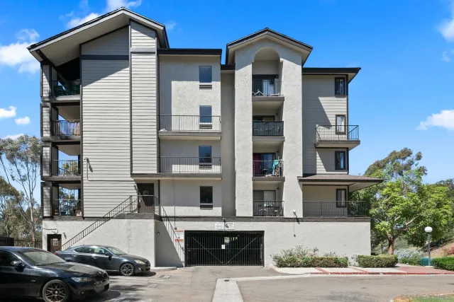 a front view of a house with parking space