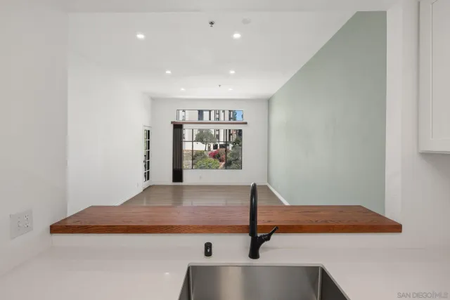 a view of a hallway with a room