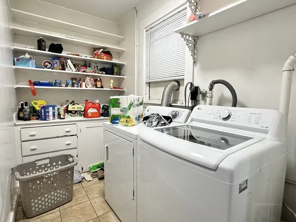 a kitchen with white cabinets and a sink