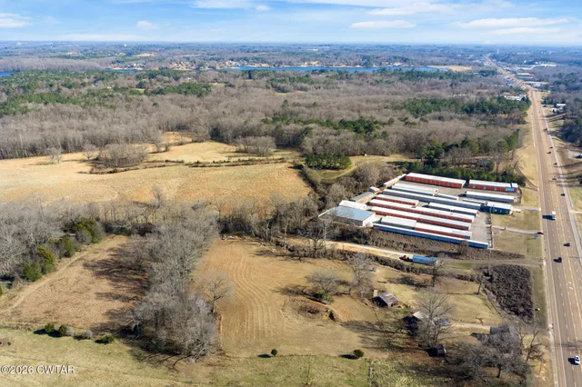 a view of open space with yard