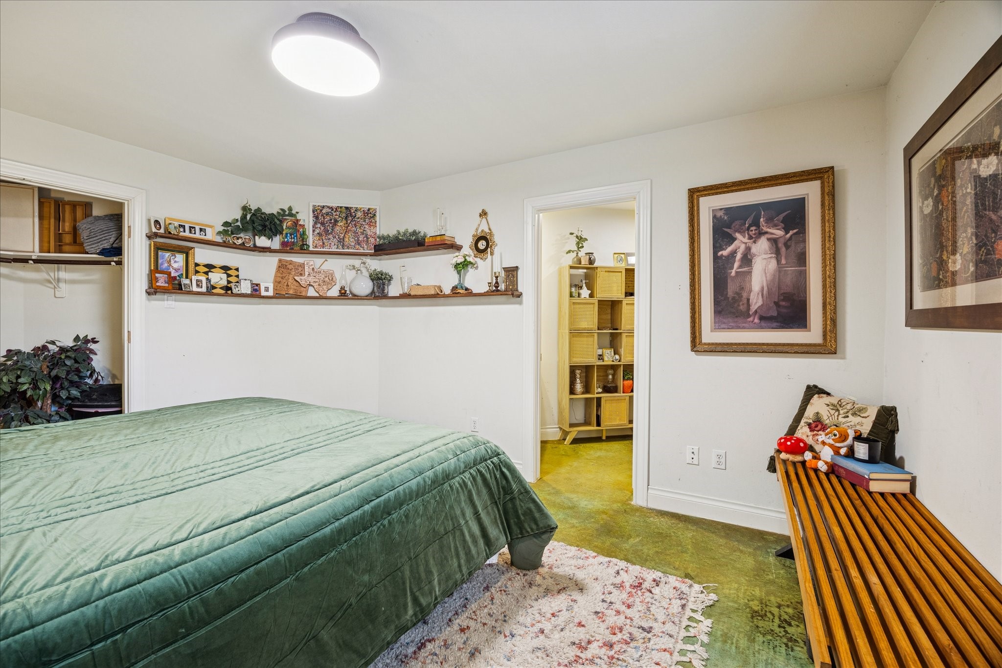 2207 Austin Street Houston, TX 77002 - Photo 11 of 34 Now we are walking into the downstairs ensuite bedroom. Closet is on the left, and bathroom straight ahead. This is currently being used as the primary bedroom.