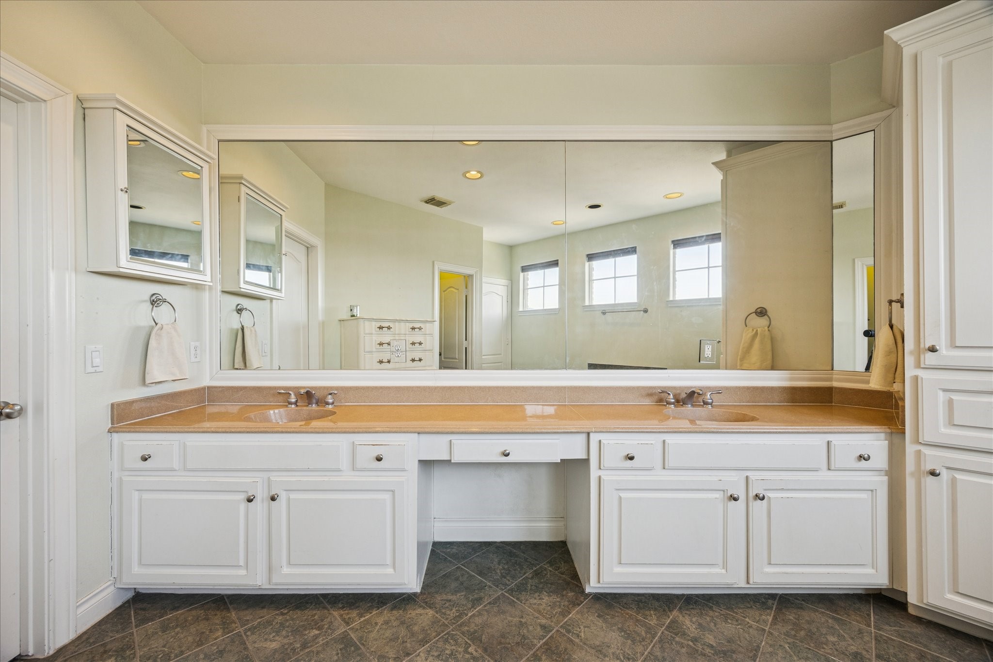 2207 Austin Street Houston, TX 77002 - Photo 20 of 34 Amazing vanity area with dual sinks. Huge closet is to the left. Lots of storage in this bathroom.