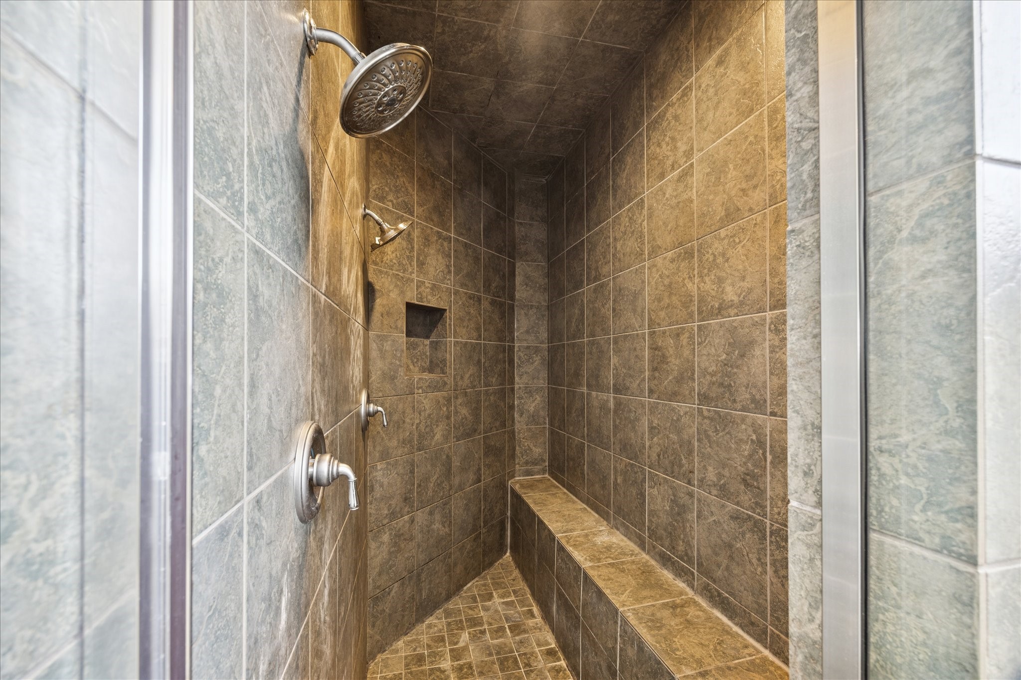 2207 Austin Street Houston, TX 77002 - Photo 21 of 34 And the walk-in shower with a long bench. Dual shower heads.