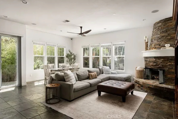 a living room with furniture and a fireplace