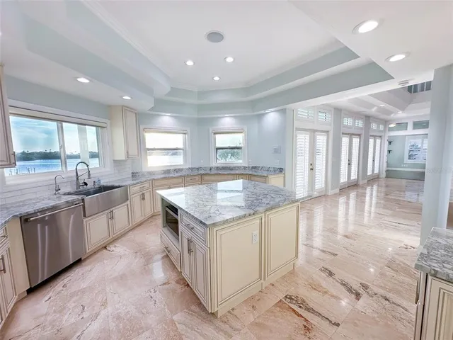 a utility room with sink dryer and washer