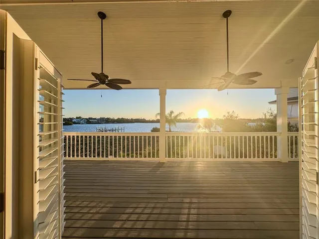 a view of a hallway with wooden floor and entryway