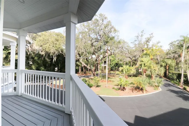 a bathroom with a granite countertop tub a sink a mirror and a window
