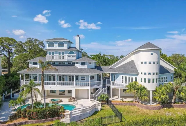 a view of a yard with plants and trees