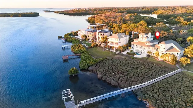 a living room with furniture and view of kitchen